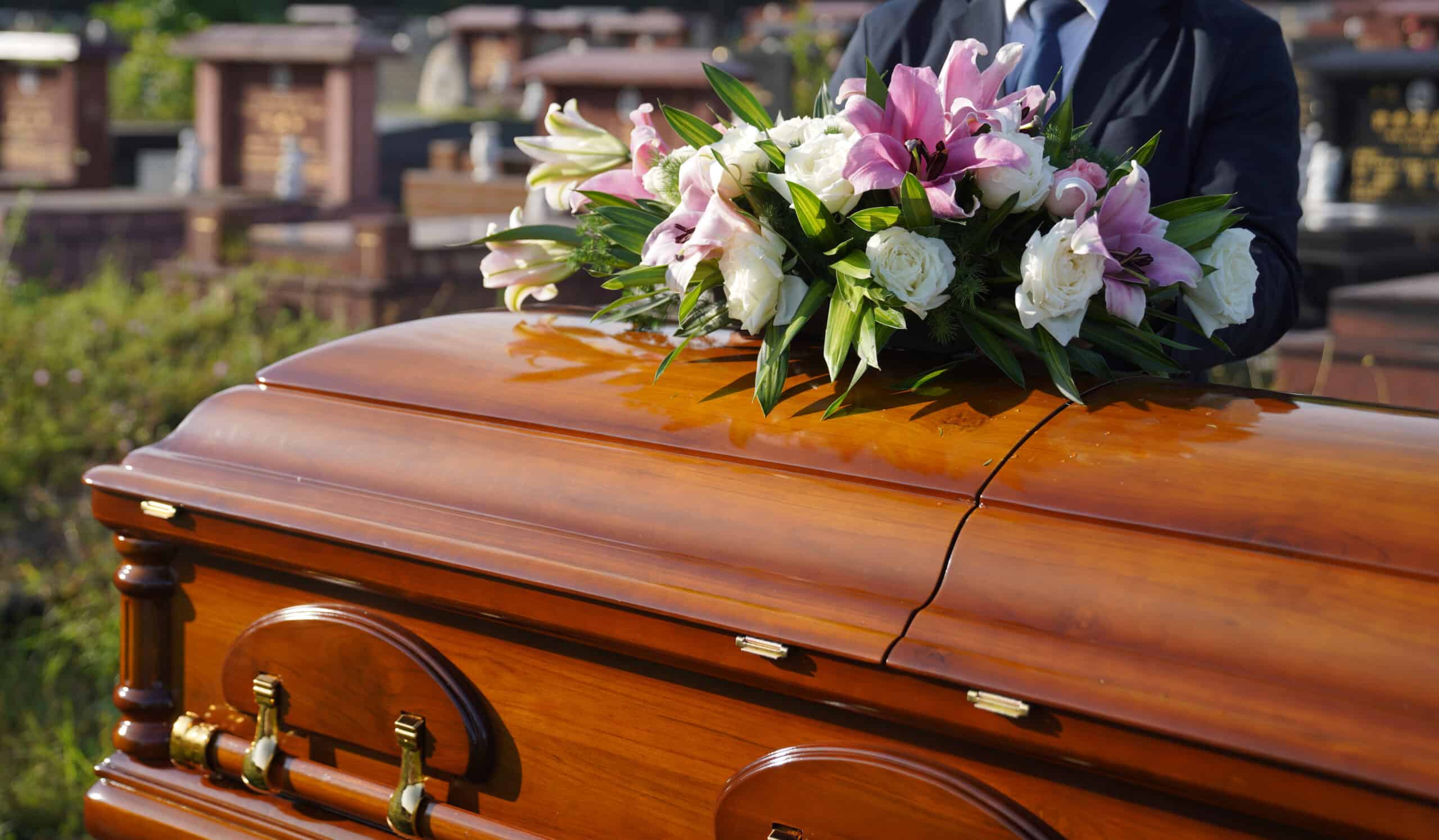 Teak wood casket during burial